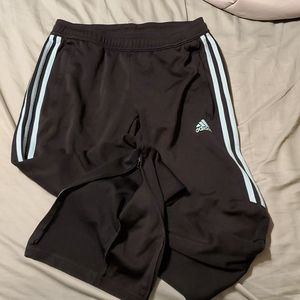 Adidas soccer  sweatpants womens size S black with blue stripes